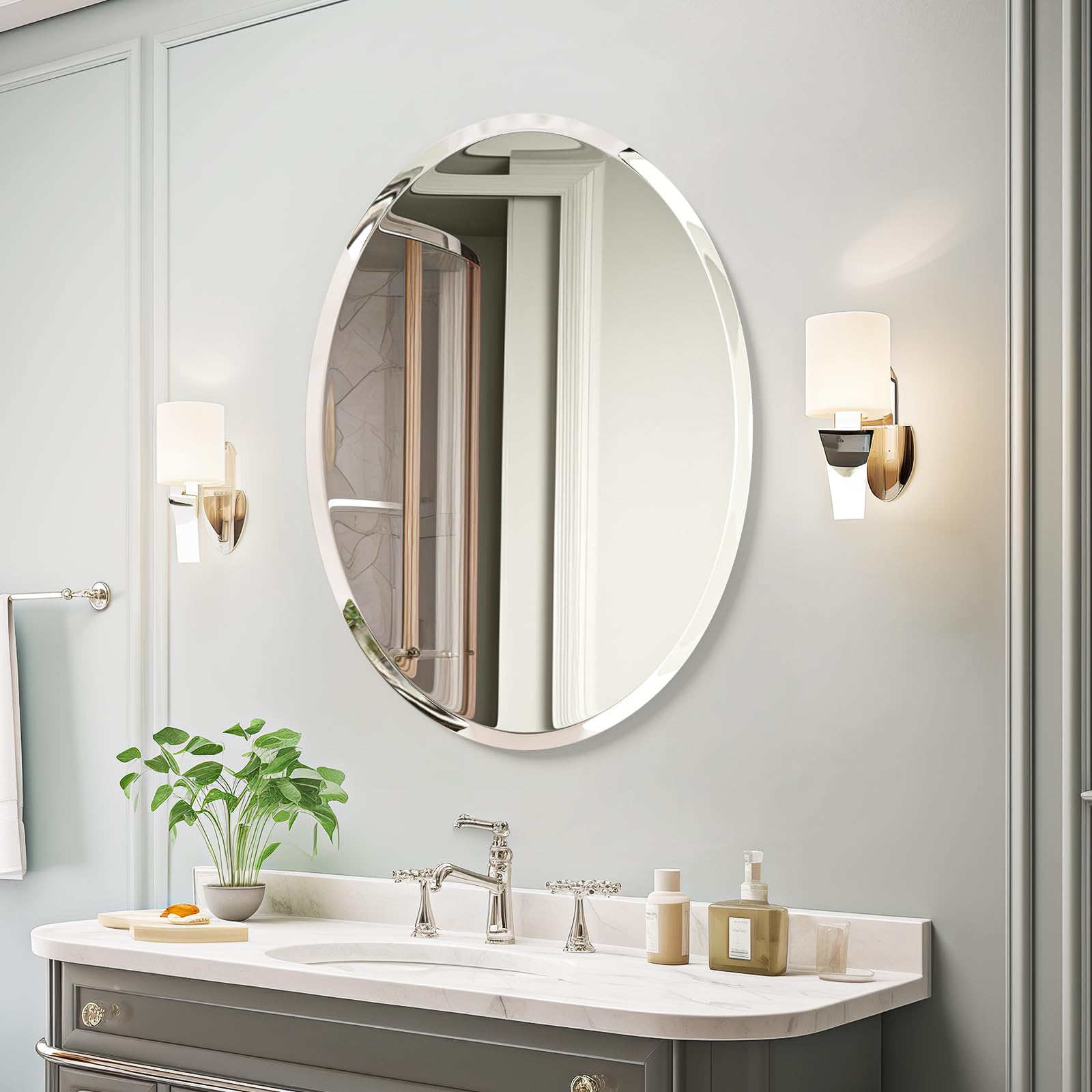 USHOWER Kadra 20x28 Frameless Oval Bathroom Mirror Over Marble Vanity with Gray Cabinets, Silver Faucet, and Sconce